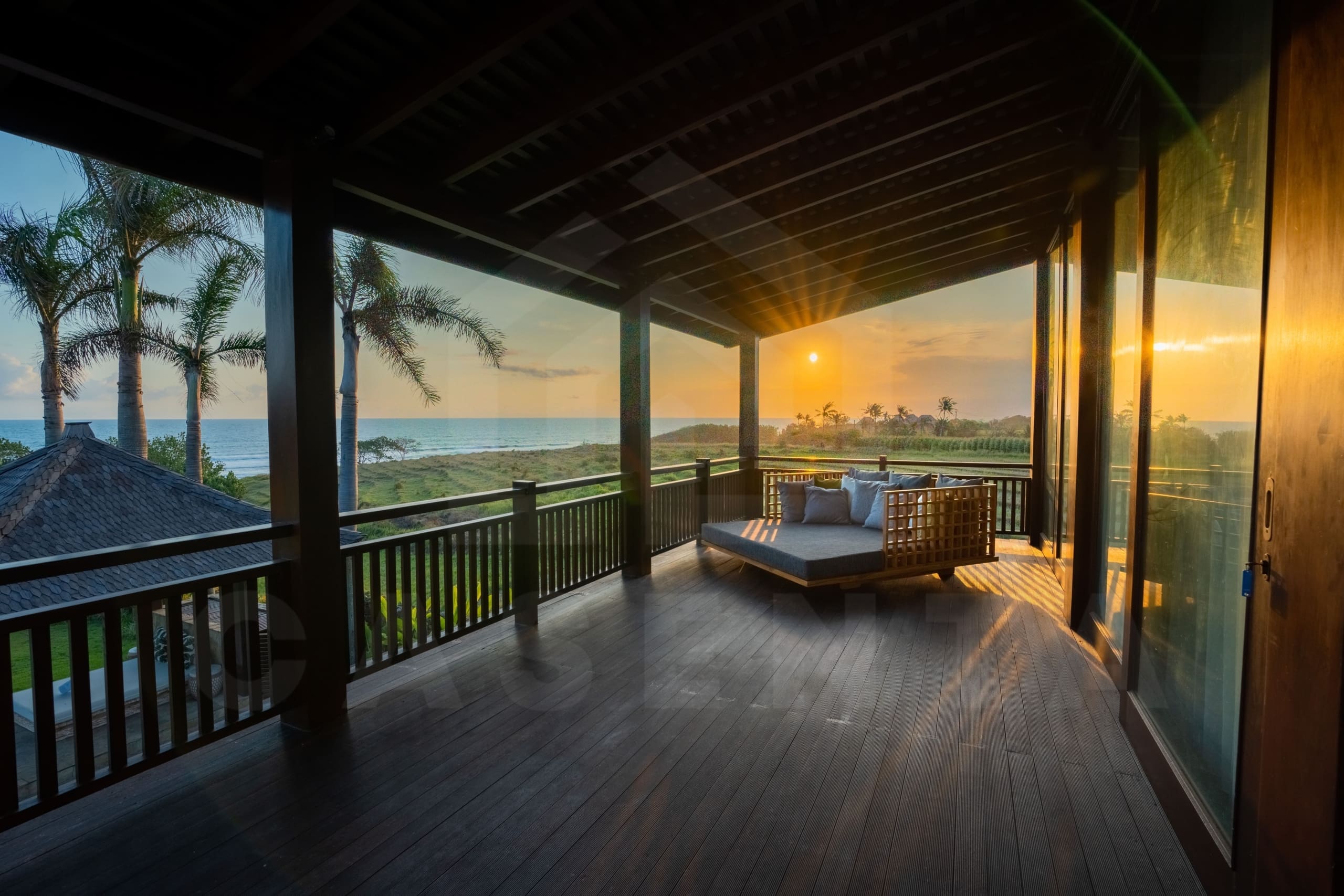 The balcony of a tropical Bali villa for sale on the Tabanan coast