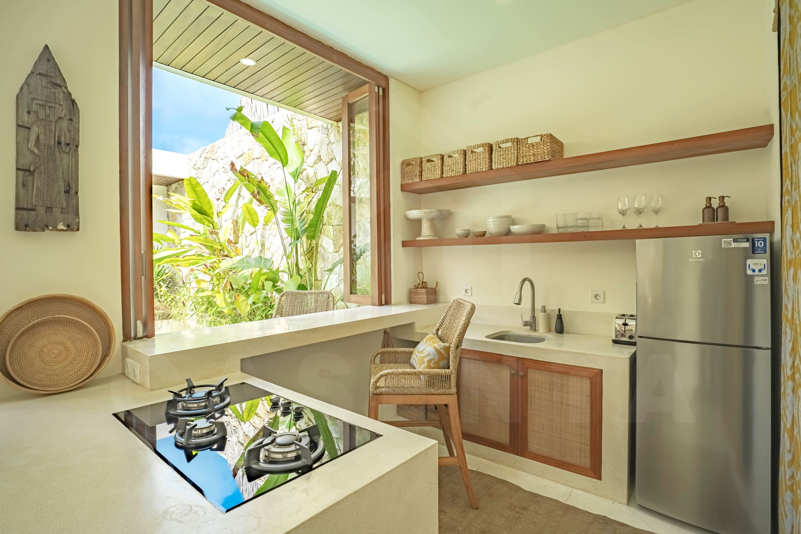 Kitchen/dining area inside attractive 2 bedroom villa in Tumbak Bayuh